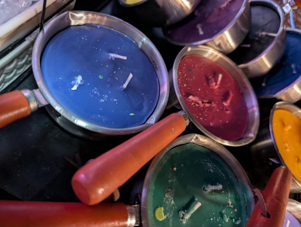 Wax play candles in coloured tins